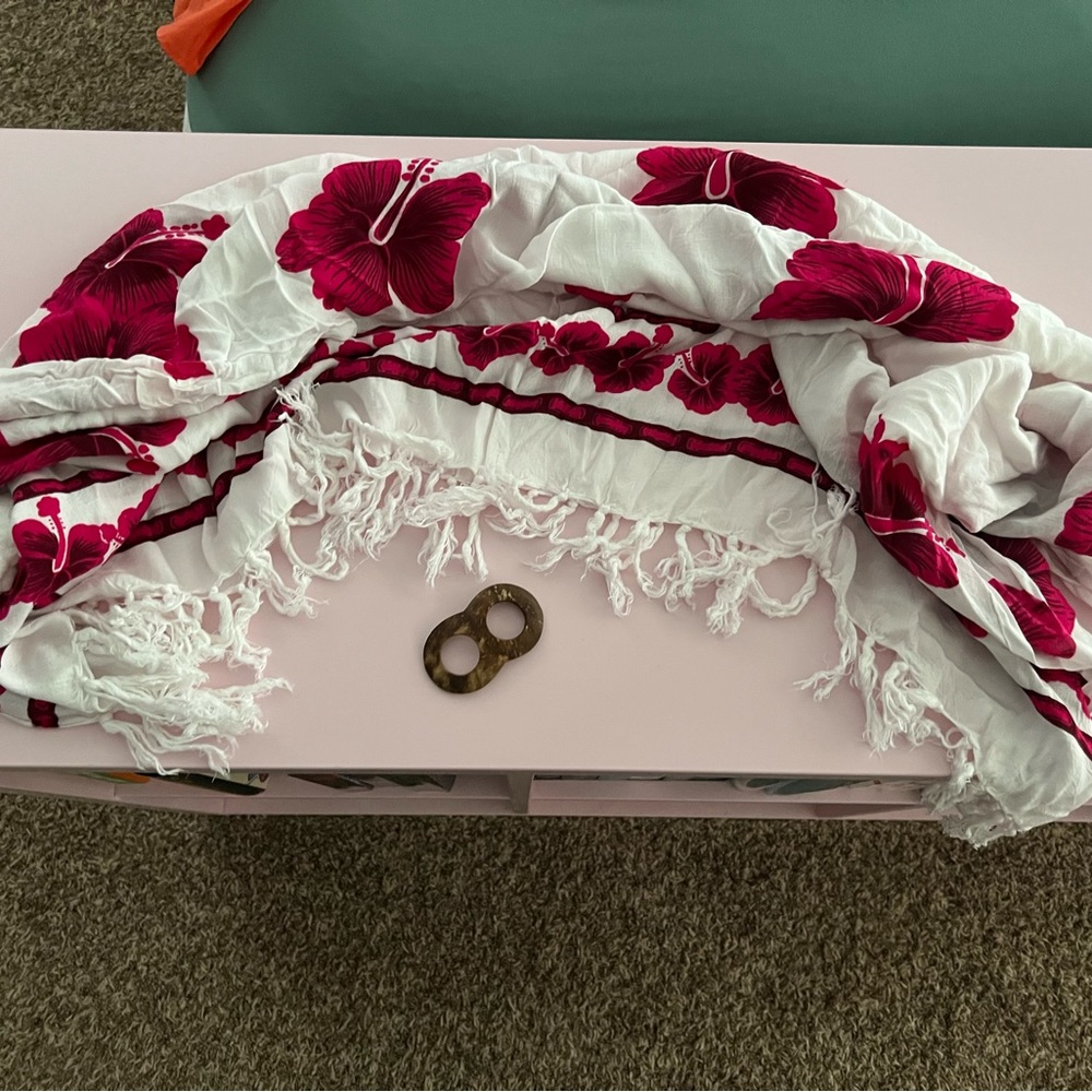 Coverup shawl. Ties around the waist and fastened with a cute wooden piece.